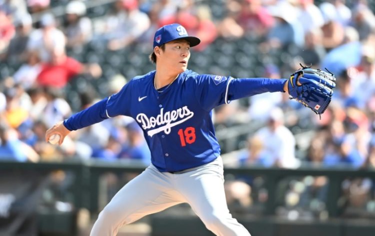 Yoshinobu Yamamoto of the Los Angeles Dodgers delivers a second-inning pitch against the Texas Rangers in his first Major League Baseball pre-season game since signing with the Dodgers from Japan. ©AFP