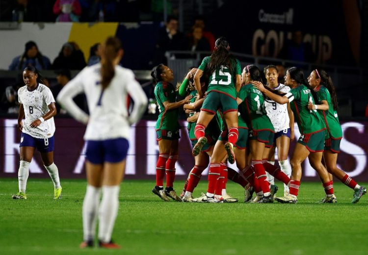 Mexico's players celebrate after their 2-0 upset of the United States at the CONCACAF women's Gold Cup. ©AFP