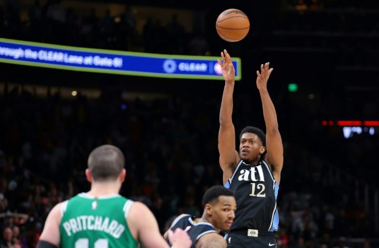 De'Andre Hunter shoots a decisive three-pointer in the dying seconds as Atlanta seal a superb come-from-behind win over Boston. ©AFP