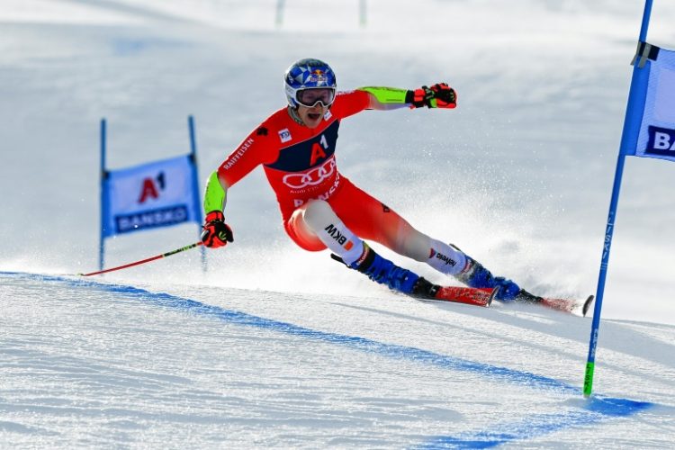 Switzerland's Marco Odermatt added the giant slalom title to his Alpine Skiing World Cup overall title on Friday . ©AFP