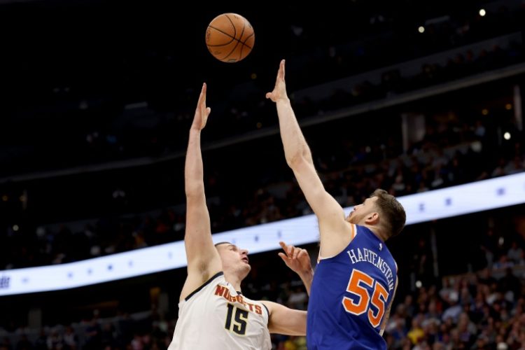 Nikola Jokic of the Denver Nuggets puts up a shot over Isaiah Hartenstein in an NBA victory over the New York Knicks. ©AFP