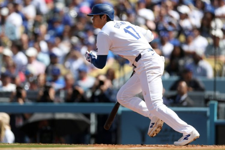 Japanese star Shohei Ohtani of the Los Angeles Dodgers singles in the fifth inning of his home debut for the Dodgers, a 7-1 triumph over St. Louis. ©AFP