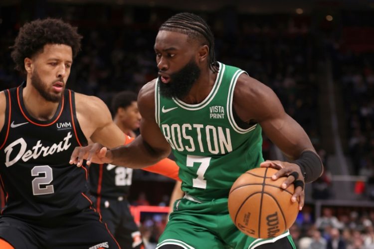 Boston's Jaylen Brown drives around Cade Cunningham in the Celtics' NBA victory over the Detroit Pistons. ©AFP