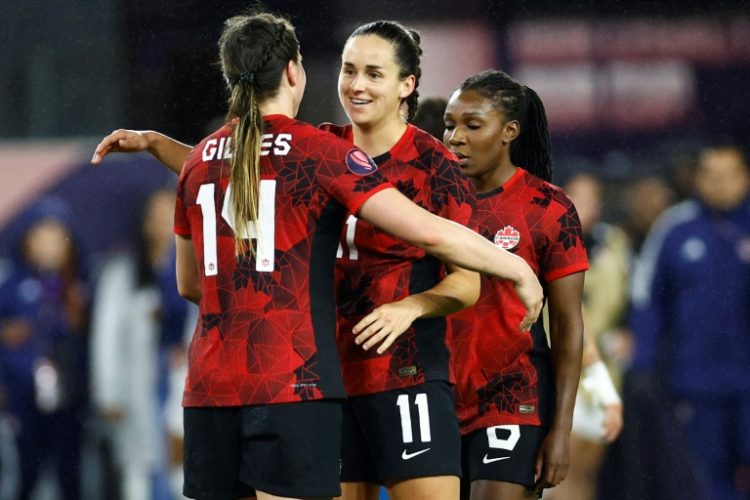 Canada players celebrate after defeating Costa Rica 1-0 in extra time to advance to the semi-finals of the CONCACAF Women's Gold Cup. ©AFP