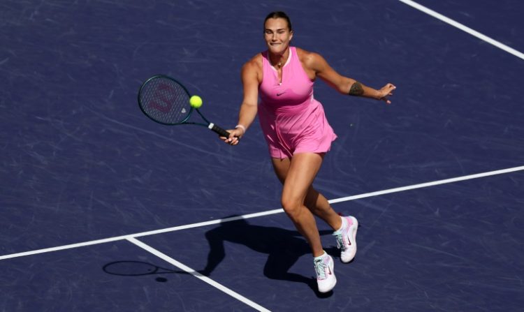 Aryna Sabalenka plays a forehand volley on her way to a straight sets victory over Emma Raducanu at the Indian Wells Masters on Monday. ©AFP