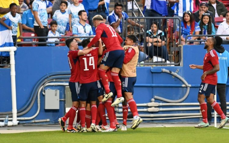 Costa Rica's players celebrate during their playoff win over Honduras to reach the Copa America. ©AFP