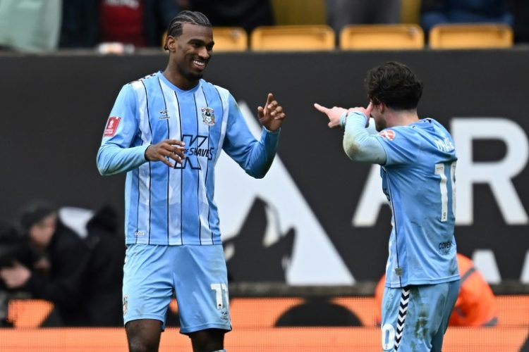 Coventry City's USA striker Haji Wright, left, celebrates with teammate Callum O'Hare after grabbing the winner in their FA Cup quarter-final against Wolverhampton Wanderers. ©AFP