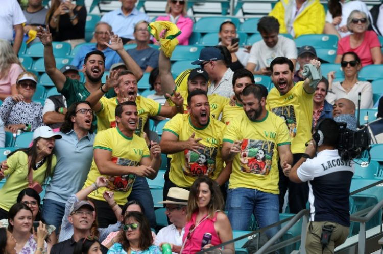 Fans of Thiago Seyboth Wild of Brazil cheer during the match against Taylor Fritz at the Miami Open at Hard Rock Stadium on Saturday.. ©AFP