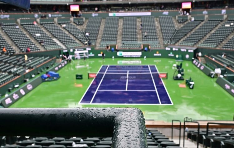 Seats are pictured empty during the rain delay that disrupted the semi-final between Carlos Alcaraz and Jannik Sinner in the ATP-WTA Indian Wells Masters. ©AFP
