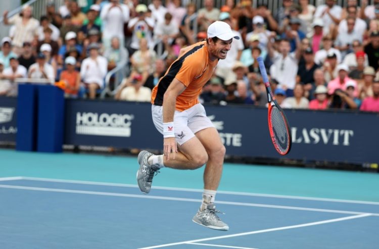 Andy Murray of Great Britain screams in pain after hurting his left ankle during his match against Tomas Machac of the Czech Republic on Day 9 of the Miami Open at Hard Rock Stadium on Sunday.. ©AFP