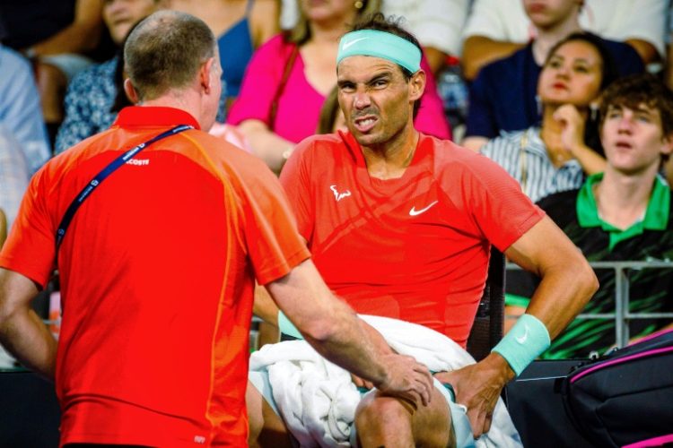 Pain game: Rafael Nadal receives medical treatment during his match against Australia's Jordan Thompson in Brisbane. ©AFP