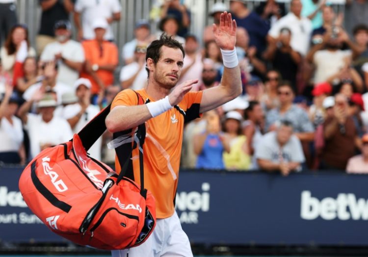 Andy Murray of Great Britain waves to the crowd after losing in three sets against Tomas Machac of the Czech Republic at the Miami Open on Sunday.. ©AFP