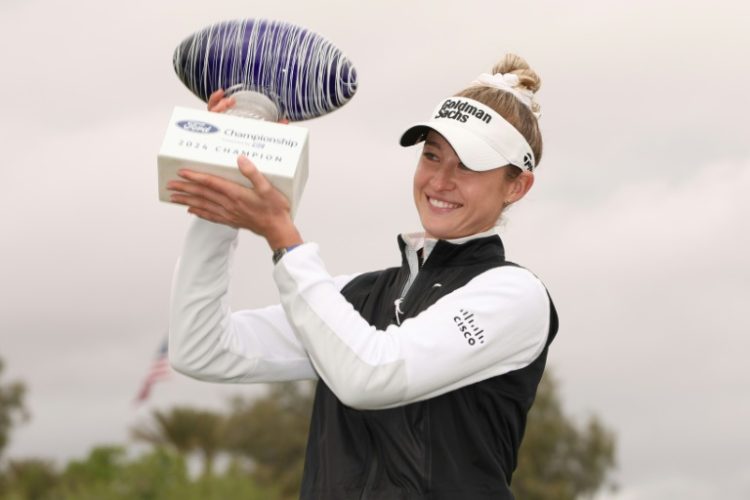 American Nelly Korda poses with the trophy after winning her third straight start on the LPGA Tour at the Ford Championship in Arizona. ©AFP