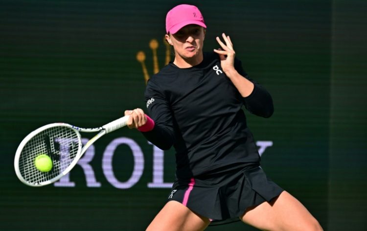 World number one Iga Swiatek belts a forehand on the way to her semi-final victory over Marta Kostyuk in the ATP-WTA Indian Wells Masters. ©AFP