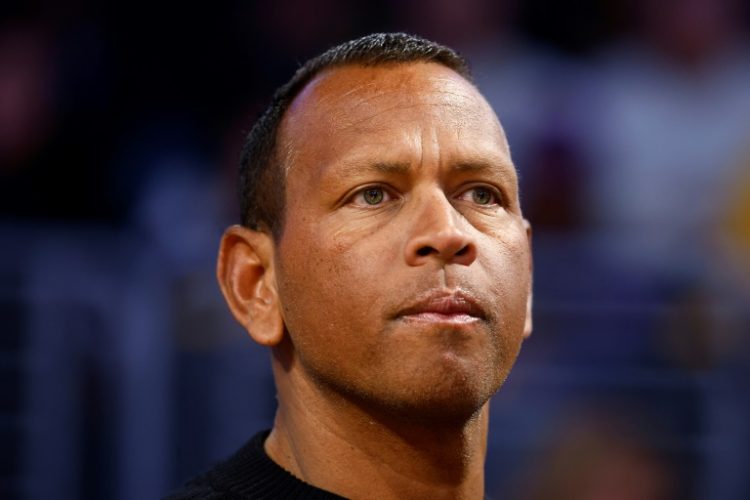 Retired Major League Baseball star Alex Rodriguez, watching a Minnesota Timberwolves NBA game, and partner Marc Lore will not be able to purchase a majority stake in the club, majority owner Glen Taylor said. ©AFP