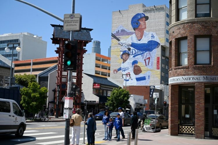 A mural showing Los Angeles Dodgers Japanese star Shohei Ohtani is Little Tokyo in downtown Los Angeles, California;   the mural, by artist Robert Vargas, is 150 feet (46 meters) tall and is titled "LA Rising.". ©AFP
