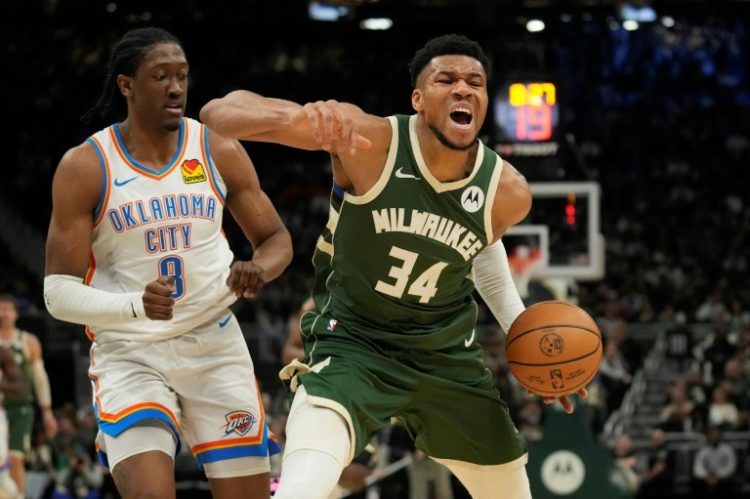 Milwaukee's Giannis Antetokounmpo, reacting to a foul by Oklahoma City's Jalen Williams, scored 30 points and grabbed a season-high 19 rebounds to lad the Bucks over the Thunder 118-93 in an NBA game. ©AFP
