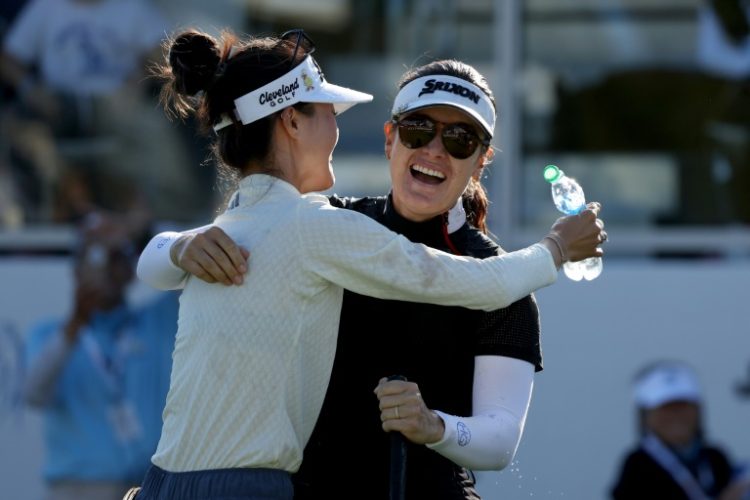 Hannah Green celebrates with fellow Australian Grace Kim after winning the LPGA's LA Championship at Wilshire Country Club on Sunday.. ©AFP
