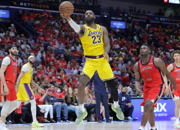 LeBron James of the Los Angeles Lakers shoots as Zion Williamson defends in the Lakers' NBA Play-in Tournament victory over the New Orleans Pelicans. ©AFP