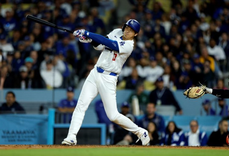 Shohei Ohtani crushes his first home run as a Los Angeles Dodger in a victory over the San Francisco Giants. ©AFP