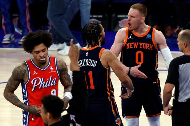 Donte DiVincenzo and Jalen Brunson of the New York Knicks celebrate late in the Knicks' victory over the Philadelphia 76ers in game two of their NBA Eastern Conference first-round series . ©AFP