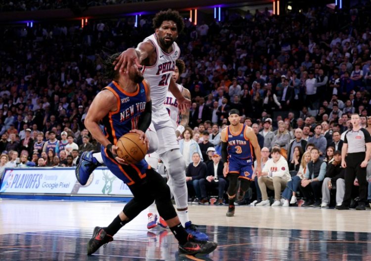 Joel Embiid (right) guards New York Knicks star Jalen Brunson in Tuesday's playoff battle at Madison Square Garden . ©AFP