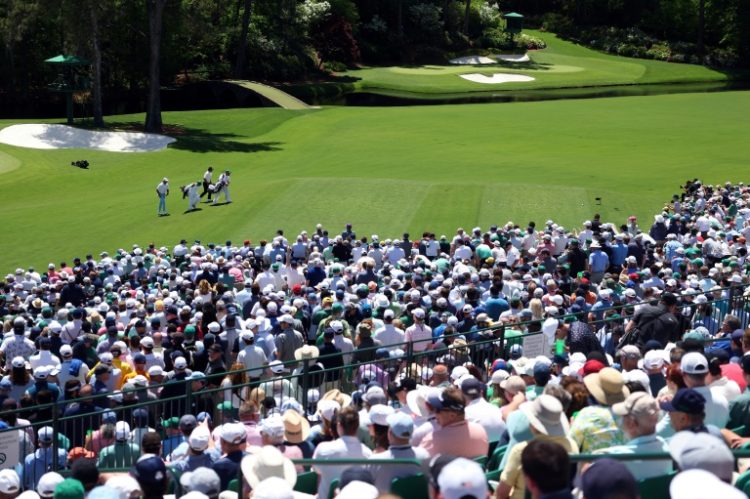 The crowds at Augusta National flocked to watch Tiger Woods on Friday as he made the cut for a record 24th time at the Masters.. ©AFP