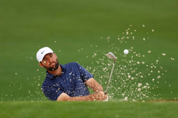 World number one Scottie Scheffler of the United States blasts out of a bunker during a practice round at Augusta National for the 88th Masters. ©AFP