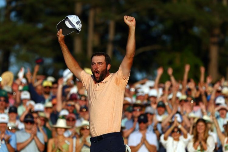 Top-ranked Scottie Scheffler of the United States celebrates on the 18th green after winning the 88th Masters for his second green jacket. ©AFP