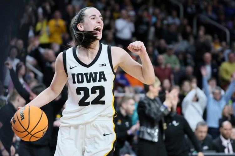 Caitlin Clark celebrates leading the Iowa Hawkeyes back to the final four of US college basketball's national championship with victory over the LSU Tigers. ©AFP