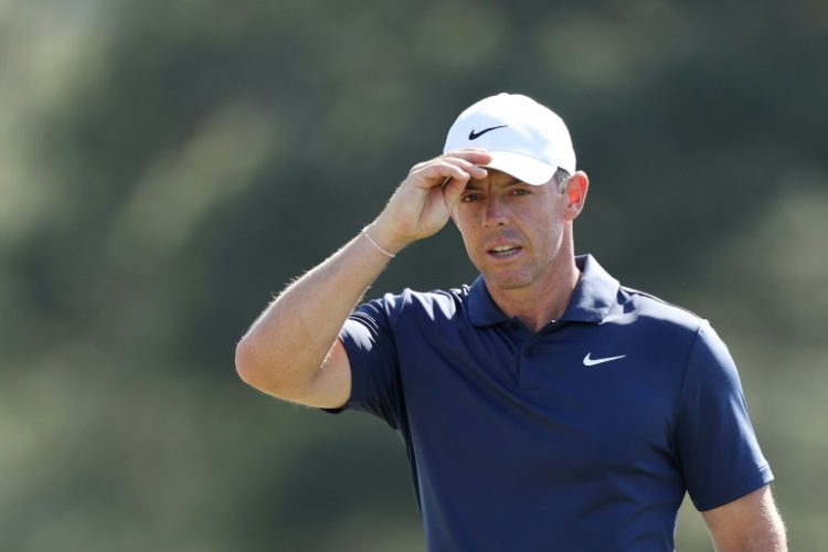 Rory McIlroy of Northern Ireland acknowledges the crowd on the 18th green during the final round of the 2024 Masters Tournament at Augusta National Golf Club. ©AFP