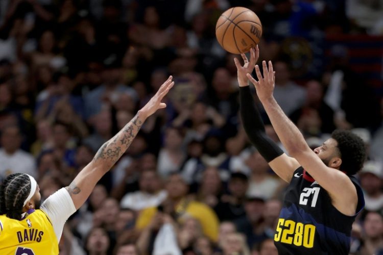 Denver's Jamal Murray puts up a last-second shot against Anthony Davis in the Nuggets' victory over the Los Angeles Lakers in game two of their NBA Western Conference playoff series. ©AFP