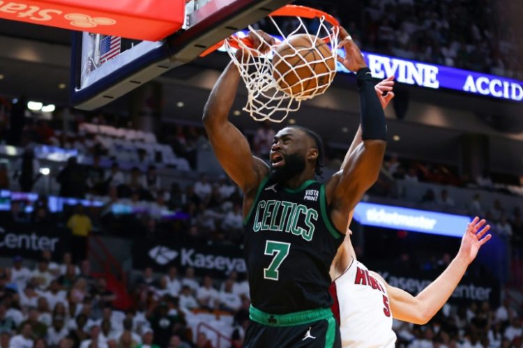 Jaylen Brown of the Boston Celtics throws down a dunk over Nikola Jovic in the Celtics' victory over the Miami Heat in game three of their NBA Eastern Conference first round playoff series. ©AFP