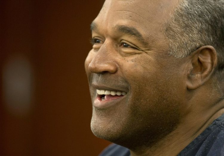 O.J. Simpson, shown here at a court hearing in 2013, went from the heights of fame as a successful football star and actor -- to the depths of infamy as a suspect in his ex-wife's murder and a conviction over a bungled armed robbery. ©AFP