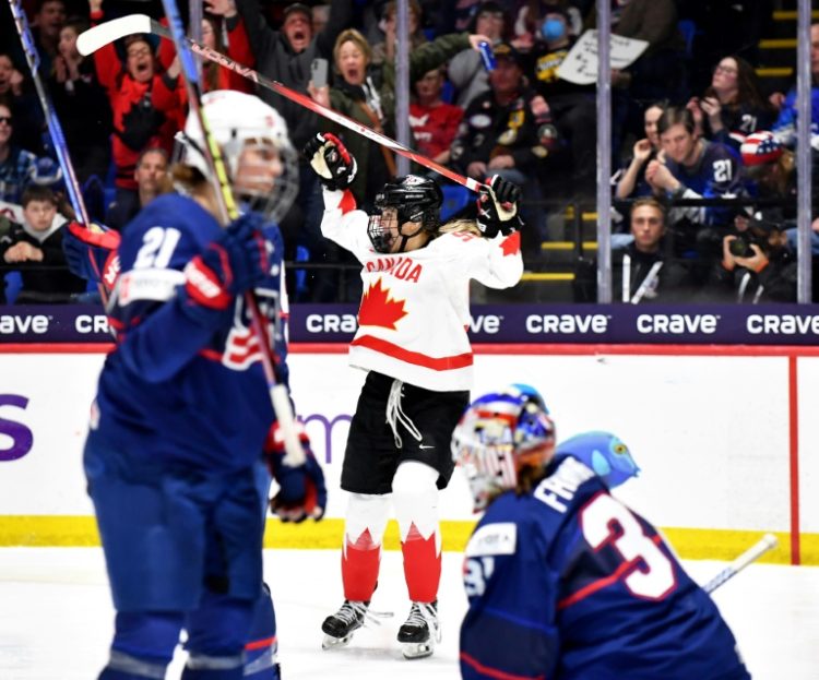 Canada's Danielle Serdachny celebrates her gold medal-winning goal in overtime against the United States in the final of the Women's Ice Hockey World Championship in Utica, New York. ©AFP