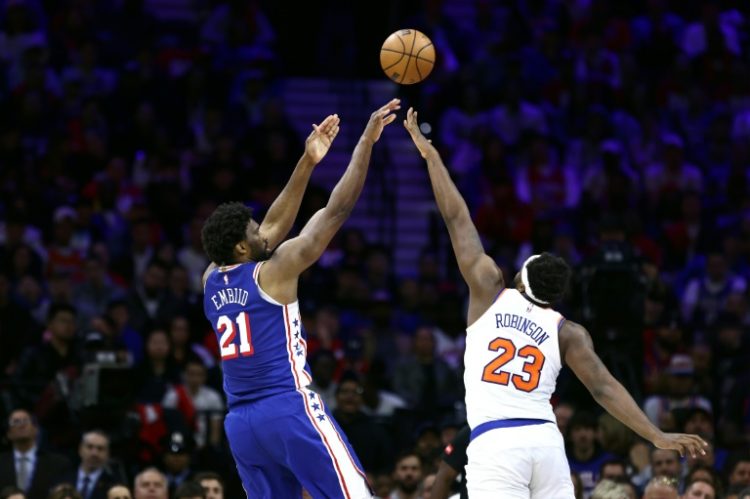 Joel Embiid of the Philadelphia 76ers shoots over New York's Mitchell Robinson in the 76ers' victory over the Knicks in game three of their NBA Eastern Conference first round series. ©AFP