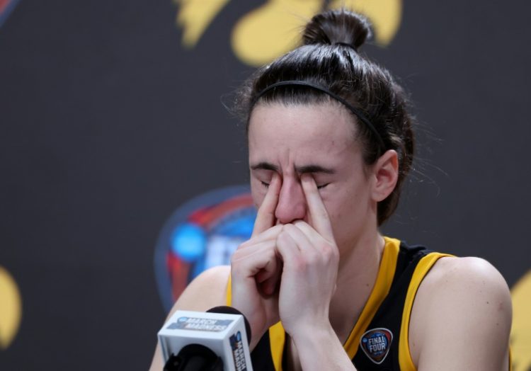 A disappointed Caitlin Clark reflects on her college career after Iowa's defeat to South Carolina on Sunday . ©AFP