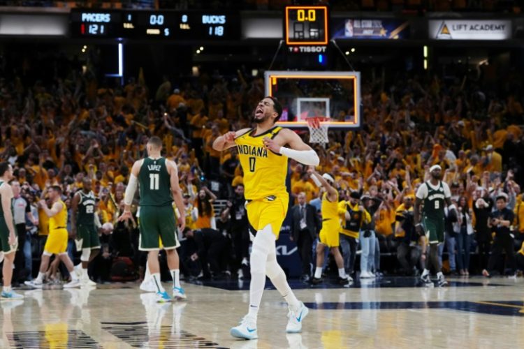Indiana's Tyrese Haliburton celebrates after making the game-winner inthe Pacers' overtime victory over the Milwaukee Bucks in game three of their NBA Eastern Conference first round playoff series. ©AFP