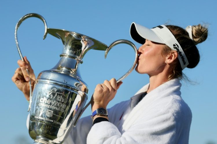 Nelly Korda, kissing the trophy after winning the Chevron Championship for her second major title and fifth win in a row, withdrew on Monday from the LA Championship. ©AFP