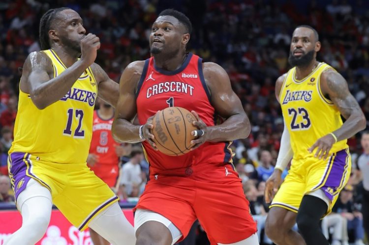 Zion Williamson (C) of the New Orleans Pelicans has been ruled out of a play-in game against the Sacramento Kings due to injury. ©AFP