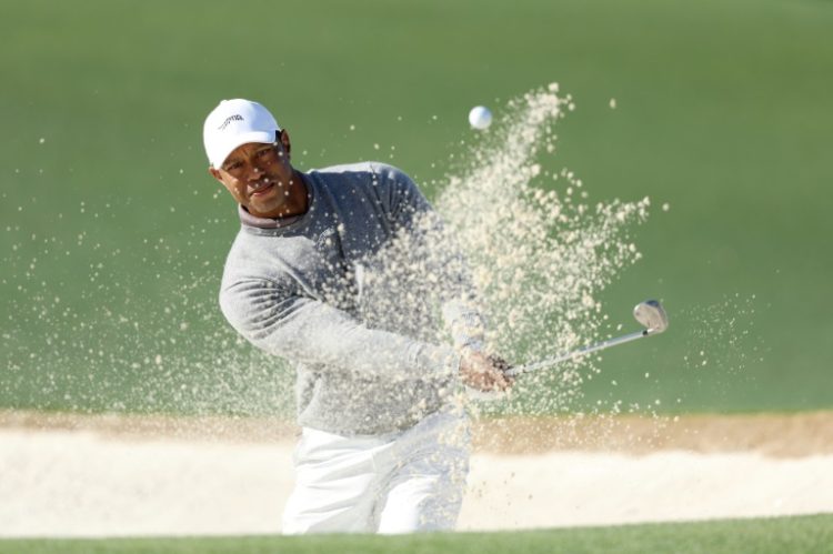 Tiger Woods, a 15-time major winner, plays a bunker shot during the second day of the 88th Masters. ©AFP