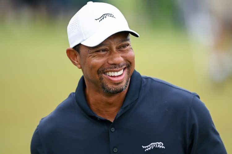 Tiger Woods, a possible 2025 US Ryder Cup captain and a negotiator in PGA Tour merger talks with the Saudi backers of LIV Golf, smiles on the practice putting green on the eve of the start of the PGA Championship at Valhalla. ©AFP