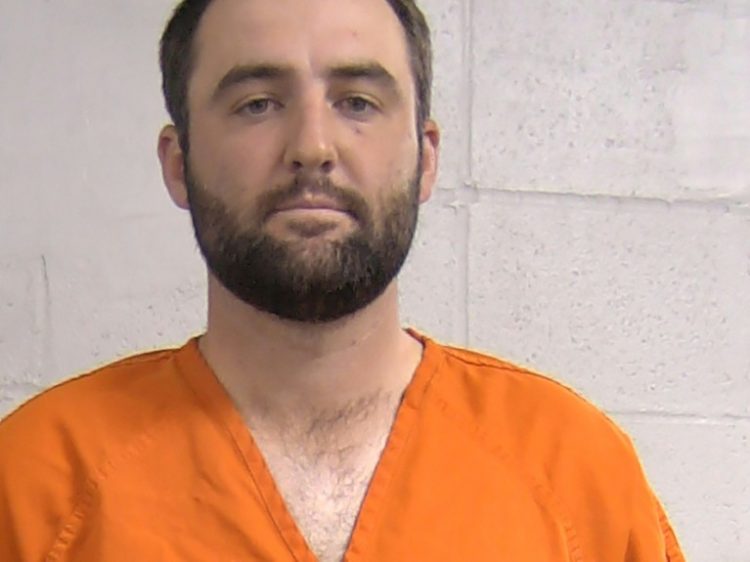 Louisville police handcuffed and booked Scottie Scheffler on multiple charges including assaulting a police officer, and took his mugshot with him dressed in an orange prison jumpsuit. ©AFP