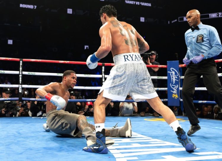 Ryan Garcia (white trunks) flattens Devin Haney during their fight last month in New York. ©AFP