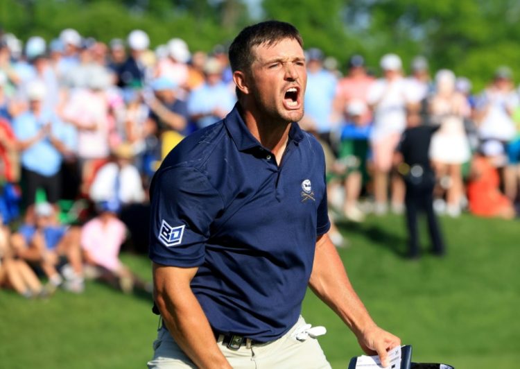 American Bryson DeChambeau roars after sinking a 10-foot birdie putt at the 18th hole to share the lead at the PGA Championship, although he would eventually lose by a stroke to Xander Schauffele. ©AFP