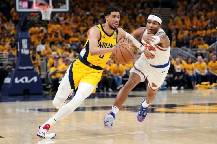 Indiana's Tyrese Haliburton drives past Miles McBride in the Pacers' series-clinching victory over the New York Knicks in the NBA Eastern Conference semi-finals. ©AFP