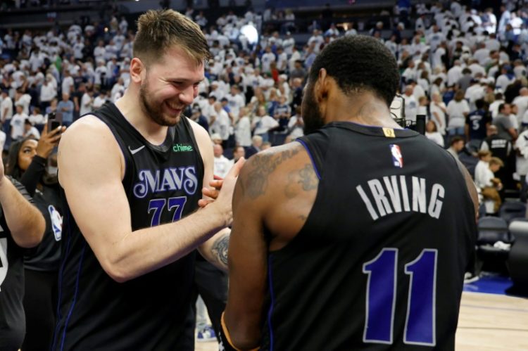 Dallas star Luka Doncic celebrates with Kyrie Irving after the Mavericks' victory over the Minnesota Timberwolves in game two of the NBA Western Conference finals. ©AFP