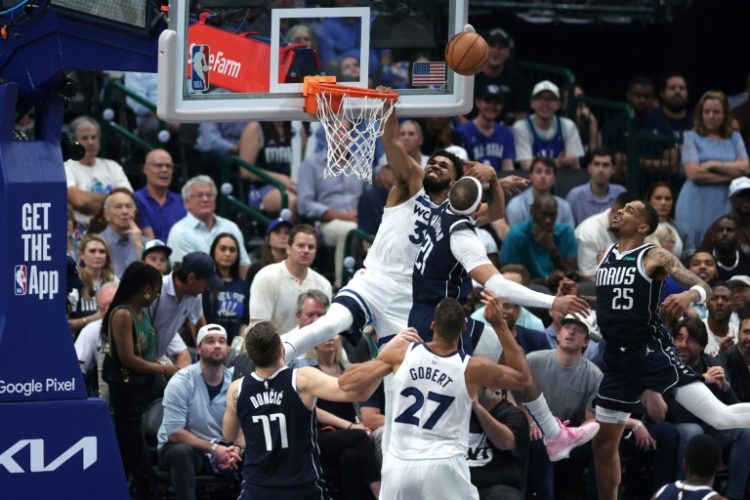 Minnesota's Karl-Anthony Towns (32) shoots over Dallas's Daniel Gafford in Wednesday's Western Conference finals game four win. ©AFP