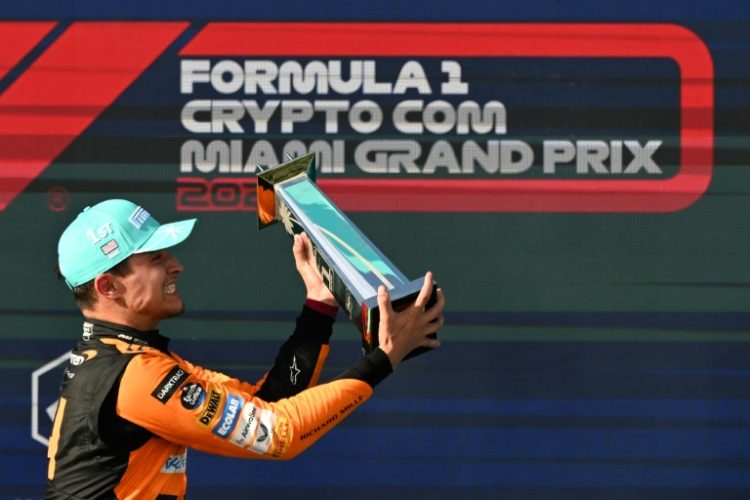 McLaren's British driver Lando Norris celebrates with his trophy after winning the Miami Grand Prix on Sunday.. ©AFP