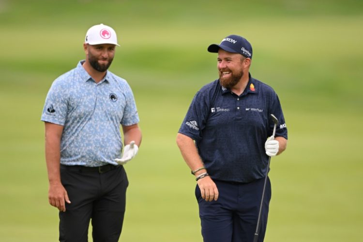 Spain's Jon Rahm, left, chats with past European Ryder Cup teammate Shane Lowry of Ireland during a practice round for the 106th PGA Championship. ©AFP